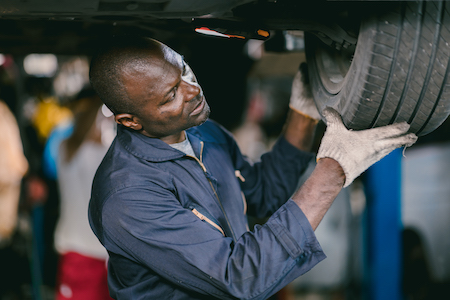 mechanic working on tire rotation service